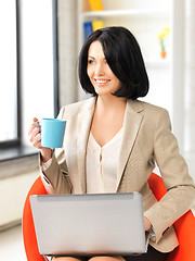 Image showing happy woman with laptop computer