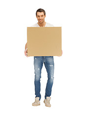 Image showing handsome man with big box