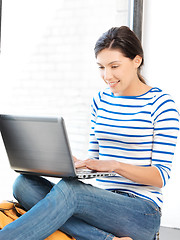 Image showing happy teenage girl with laptop computer