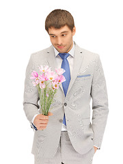 Image showing handsome man with flowers in hand