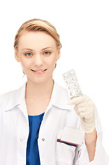 Image showing attractive female doctor with pills