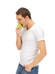 Image showing man in white shirt with green apple