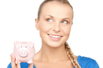 Image showing lovely woman with piggy bank