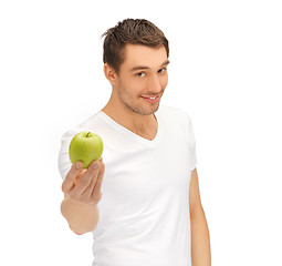 Image showing man in white shirt with green apple