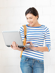 Image showing happy teenage girl with laptop computer