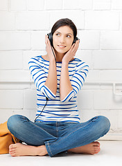 Image showing happy teenage girl in big headphones