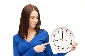 Image showing woman holding big clock