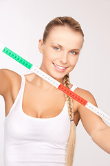 Image showing young beautiful woman with measure tape