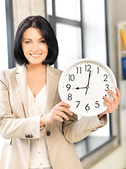 Image showing businesswoman with clock