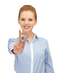 Image showing young woman showing victory sign