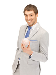 Image showing man with piggy bank