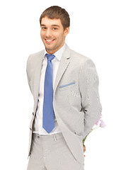 Image showing handsome man with flowers in hand