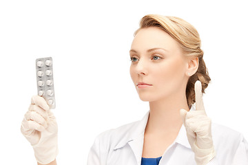 Image showing attractive female doctor with pills