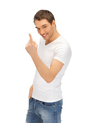 Image showing man in white shirt making inviting gesture