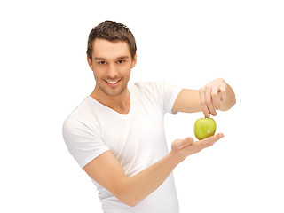 Image showing man in white shirt with green apple