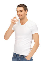 Image showing man in white shirt with glass of water