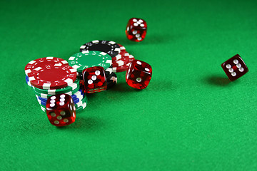 Image showing An Action shot of 5 dice thrown onto the table