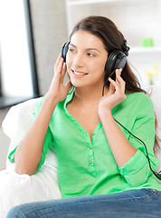 Image showing happy teenage girl in big headphones