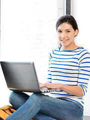 Image showing happy teenage girl with laptop computer