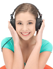 Image showing happy teenage girl in big headphones