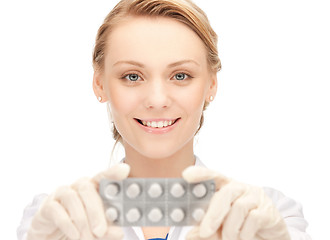 Image showing attractive female doctor with pills