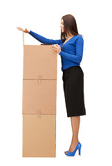 Image showing attractive businesswoman with big boxes