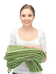 Image showing lovely housewife with towels