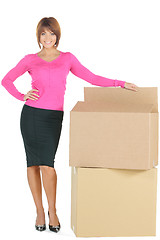 Image showing attractive businesswoman with big boxes