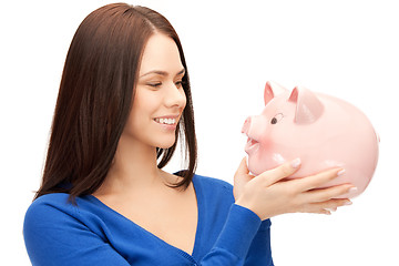 Image showing lovely woman with piggy bank