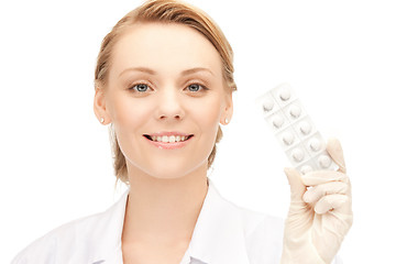 Image showing attractive female doctor with pills