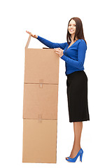 Image showing attractive businesswoman with big boxes