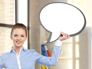 Image showing smiling businesswoman with blank text bubble