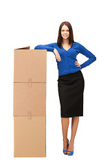 Image showing attractive businesswoman with big boxes