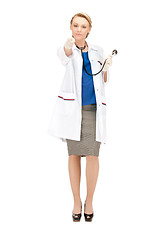 Image showing attractive female doctor pointing her finger