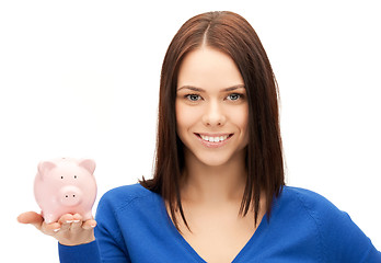 Image showing lovely woman with piggy bank