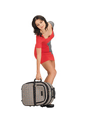 Image showing unhappy woman with heavy suitcase