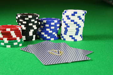 Image showing Poker cards face down with poker chips in the background