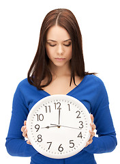 Image showing woman holding big clock