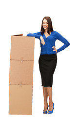 Image showing attractive businesswoman with big boxes