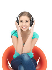 Image showing happy teenage girl in big headphones