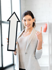 Image showing businesswoman with direction arrow sign