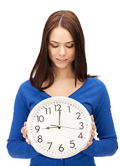 Image showing woman holding big clock