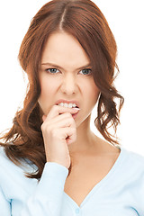 Image showing woman biting her finger