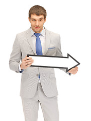 Image showing businessman with direction arrow sign