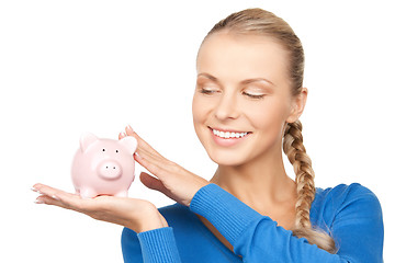 Image showing lovely woman with piggy bank