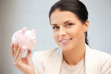 Image showing lovely woman with piggy bank