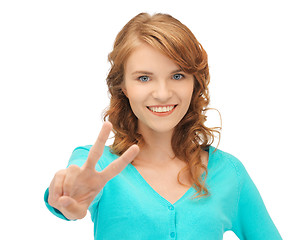 Image showing teenage girl showing victory sign