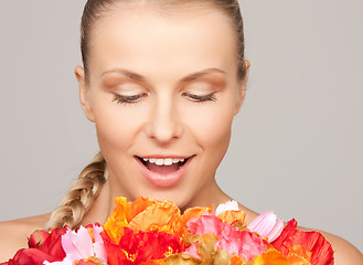 Image showing lovely woman with red flowers