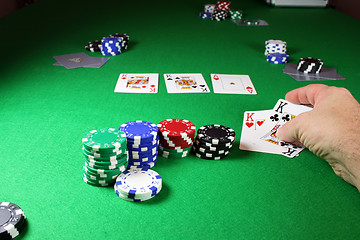 Image showing The winning hand - Showing quad kings