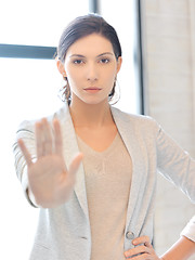 Image showing young woman making stop gesture